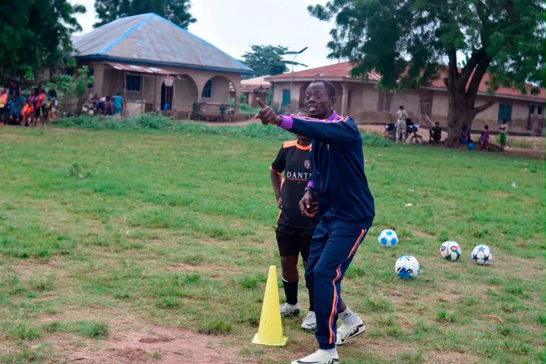 A Dante coach directing an academy training session