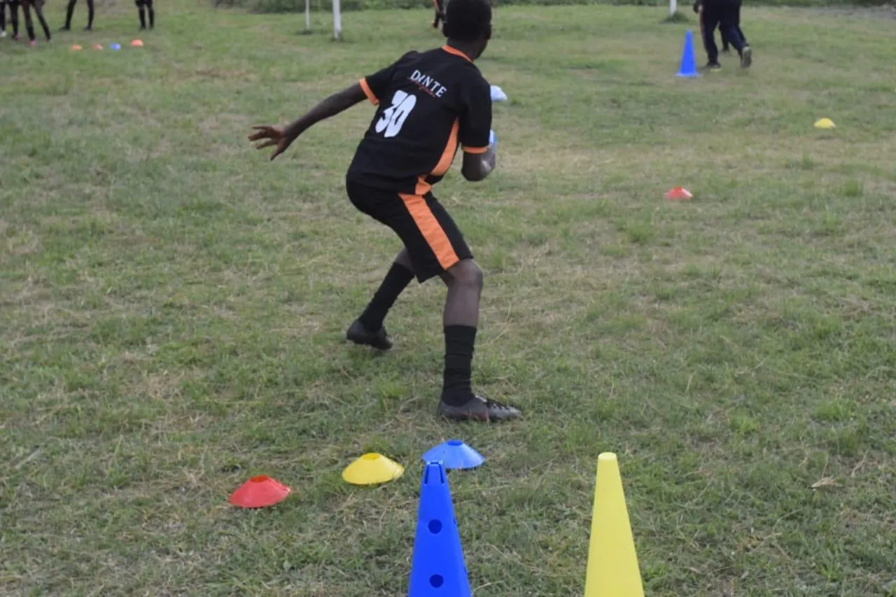 A Dante player moving through a cone-based training drill