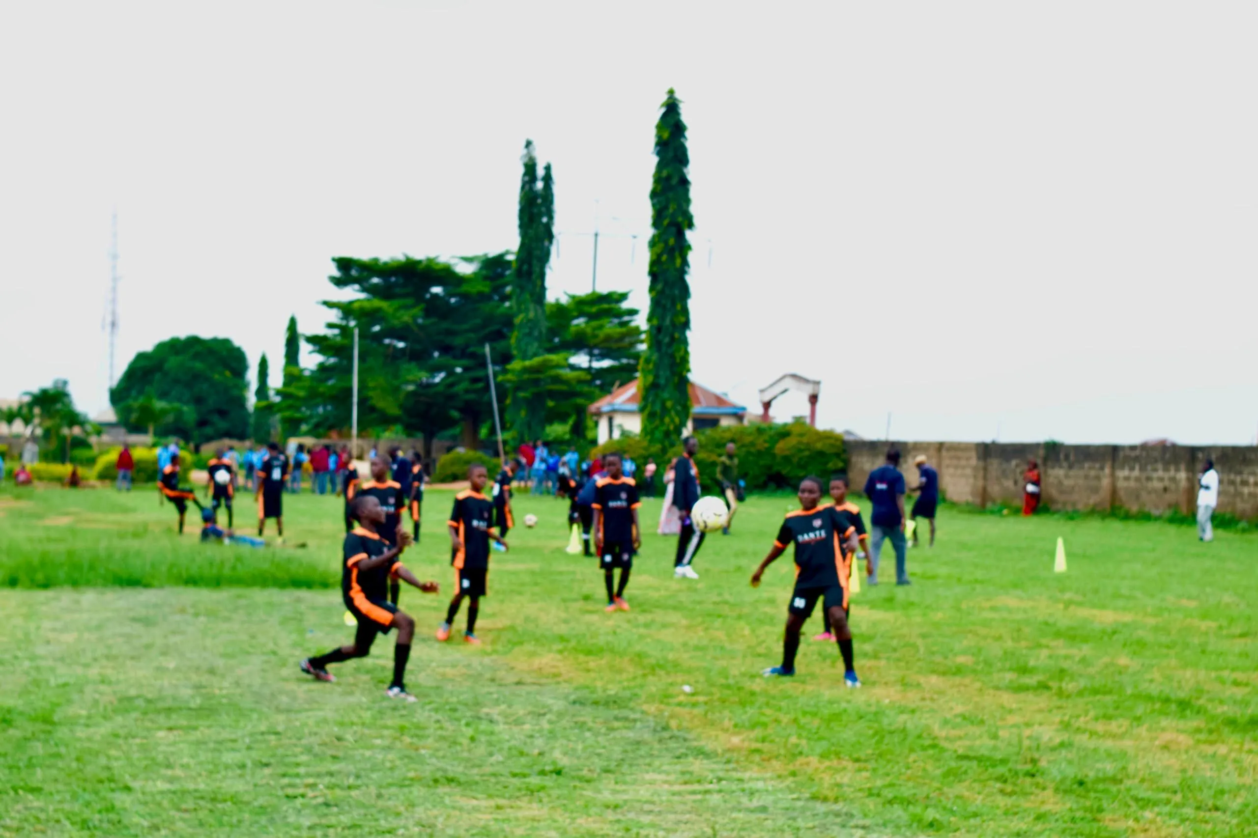 Dante players training across the academy pitch in official kit